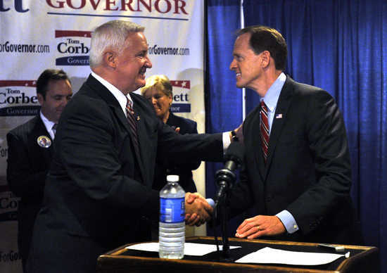 Republican candidates, Corbett and Toomey, shake hands at Penn State rally.