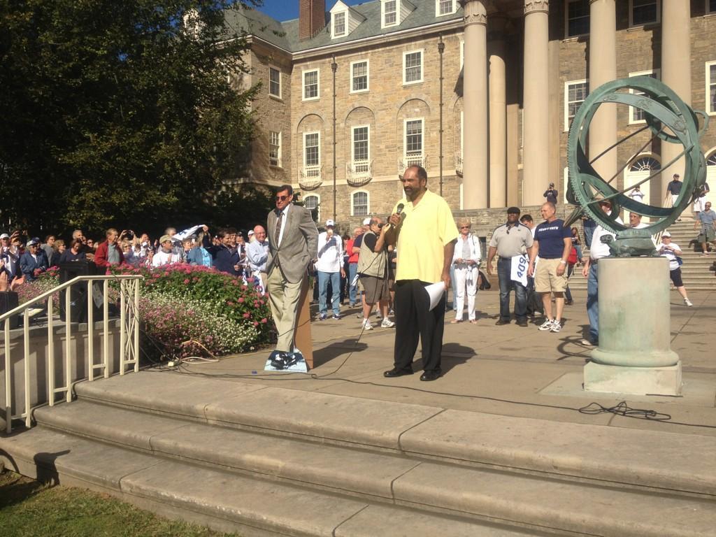 in front of a JVP cardboard cutout